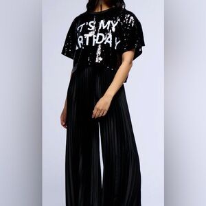 AKIRA. ITS MY BIRTHDAY SEQUIN T SHIRT, CROPPED. BLACK. WHITE LETTERS. O/S.
